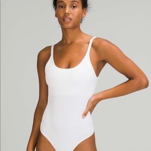 Lululemon Ebb To Street Bodysuit White SZ 10 NWT it’s made with ribbed material